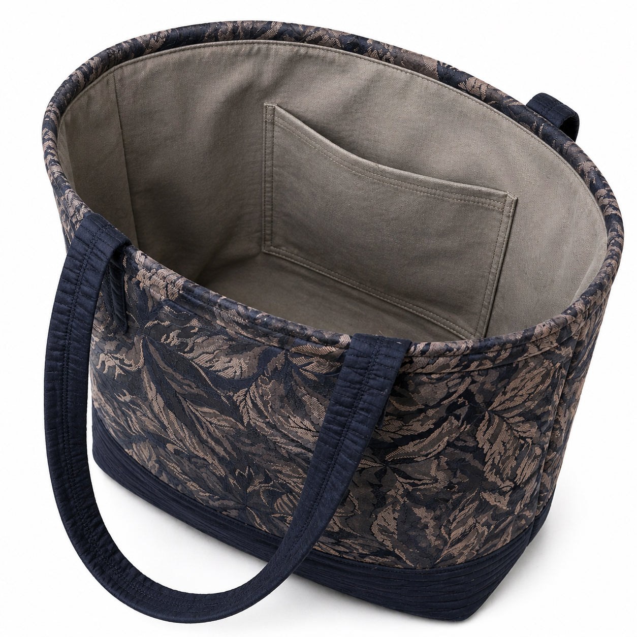 Tote Bag: Navy and Taupe leaf pattern with navy base and straps tote bag - Lightweight - Eco conscious.