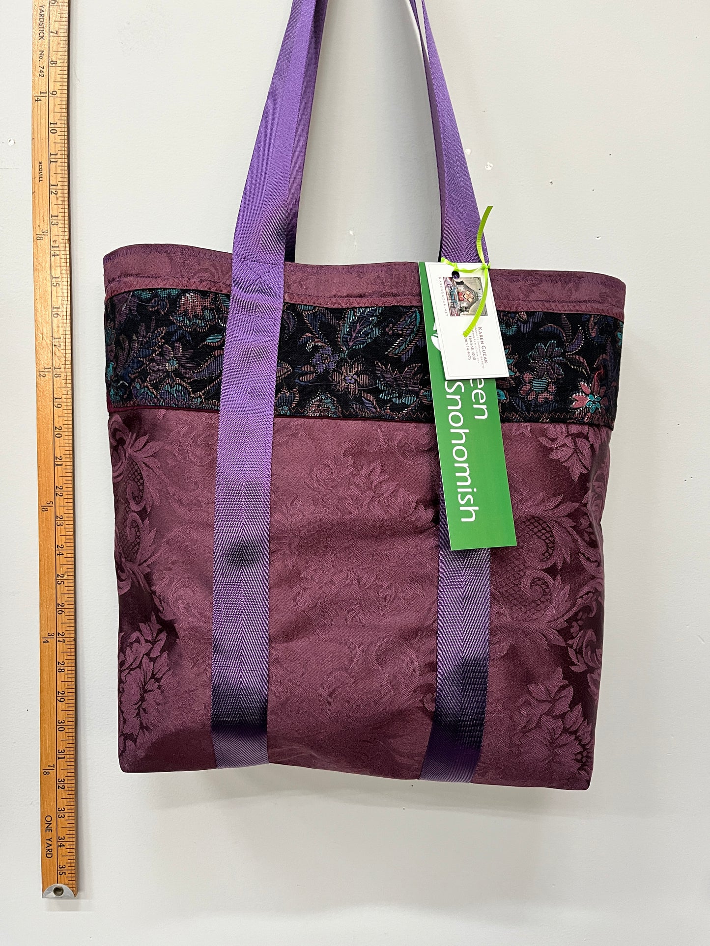 luscious purples shine with a brocade strip, and a bright turquoise silk lining.