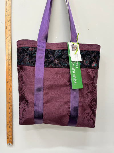 luscious purples shine with a brocade strip, and a bright turquoise silk lining.