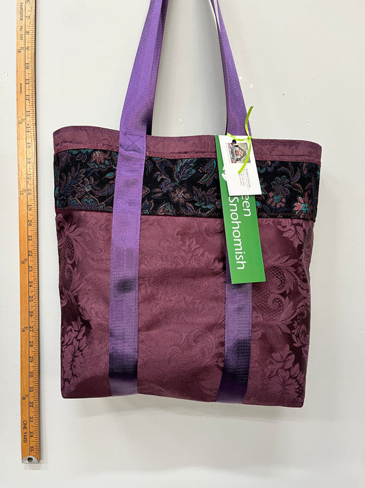 luscious purples shine with a brocade strip, and a bright turquoise silk lining.